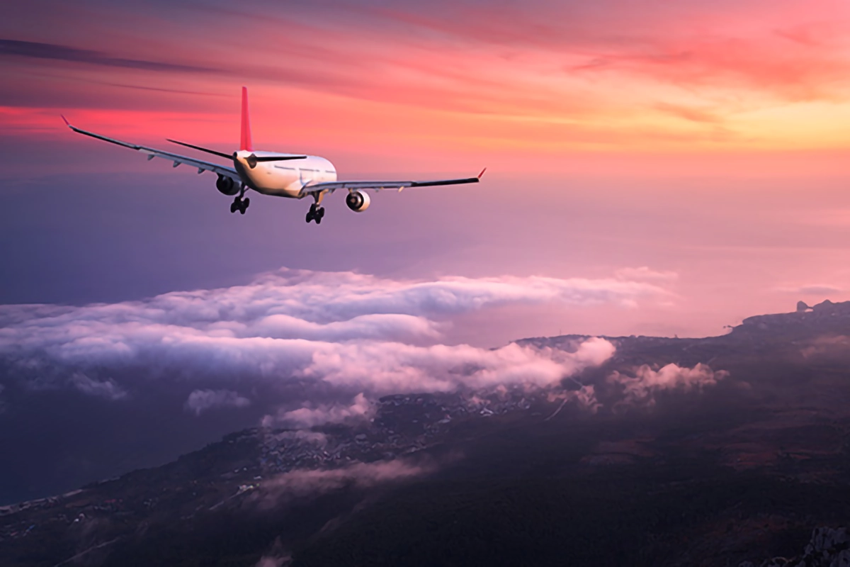 Jet Airliner on red sunset sky